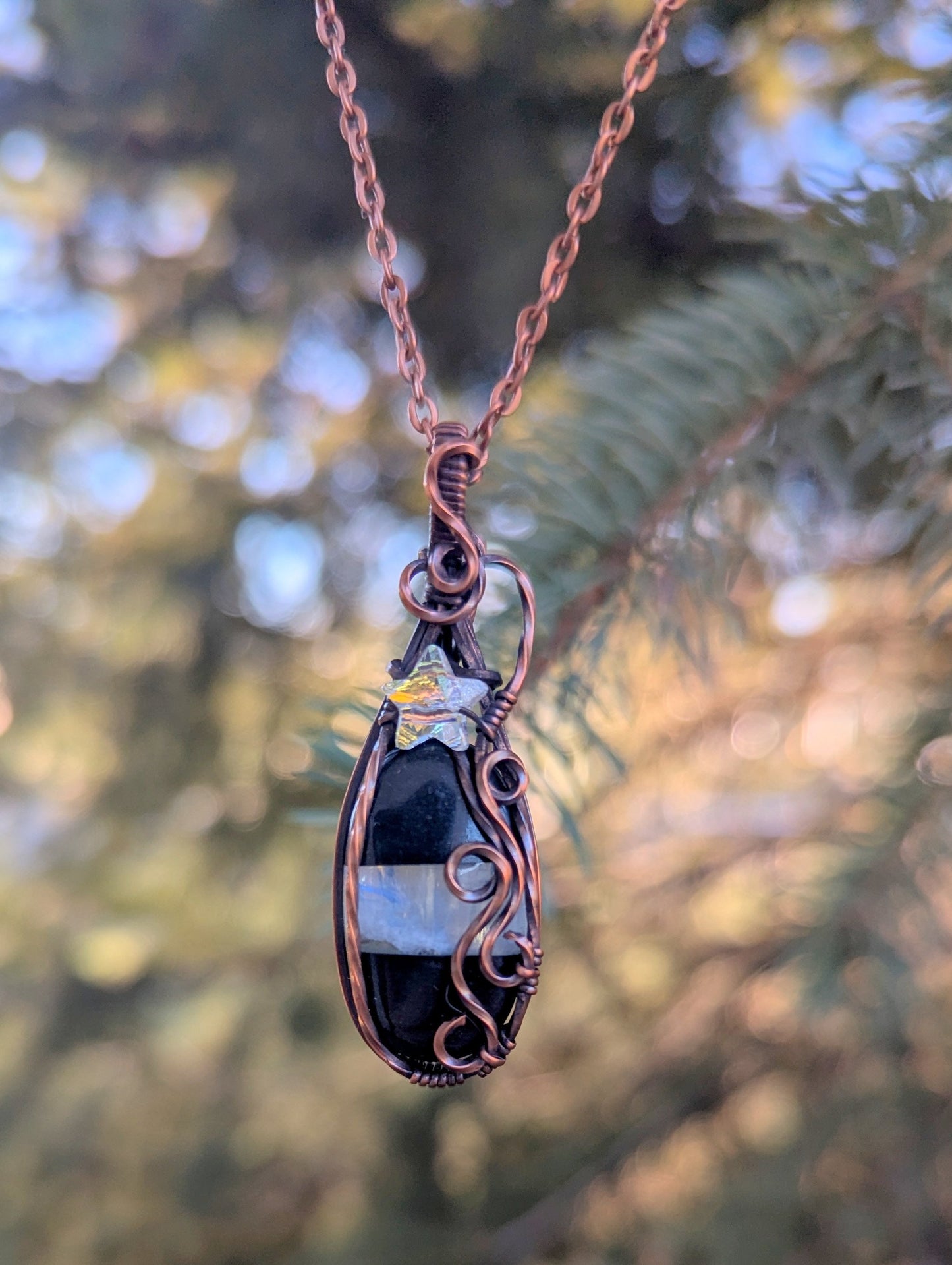 Onyx/moonstone gem pendant - wire wrapped in copper with white star crystal