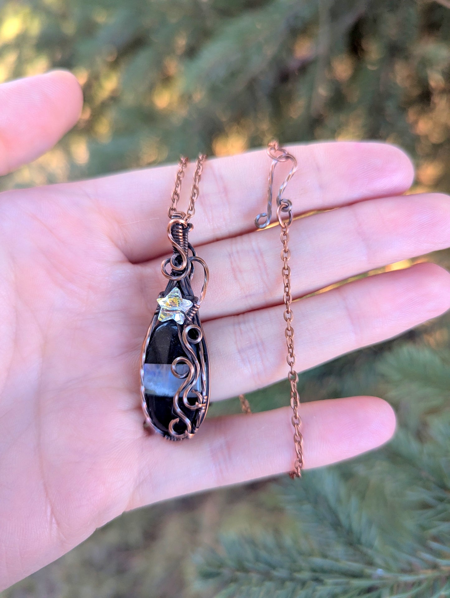 Onyx/moonstone gem pendant - wire wrapped in copper with white star crystal