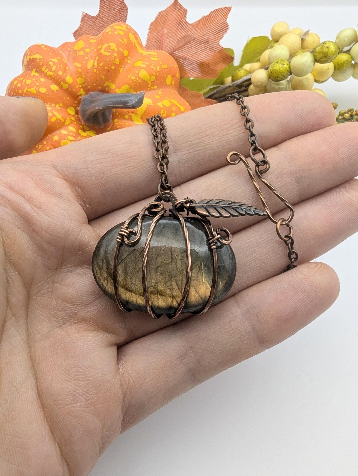 A wire wrapped labradorite pumpkin pendant